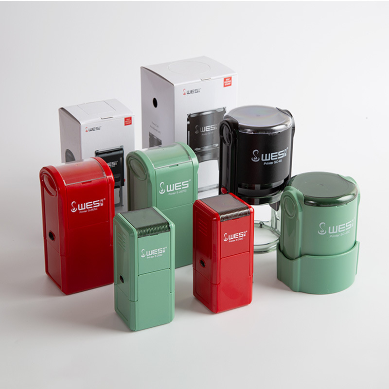 Custom Wanxi ink‑replenishing stamp material: flip‑top, rotating red and green stamps, including ink cartridges and base caps; round, clear‑text stamps.