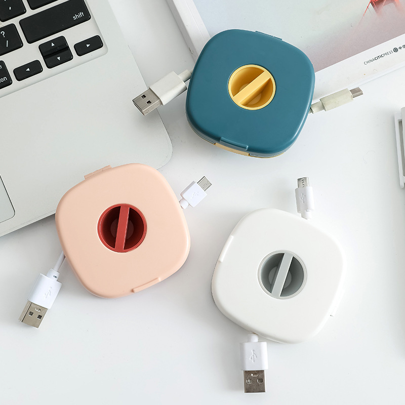 Multi-purpose portable rotating data cable organizer with phone holder, mobile charging cable winder