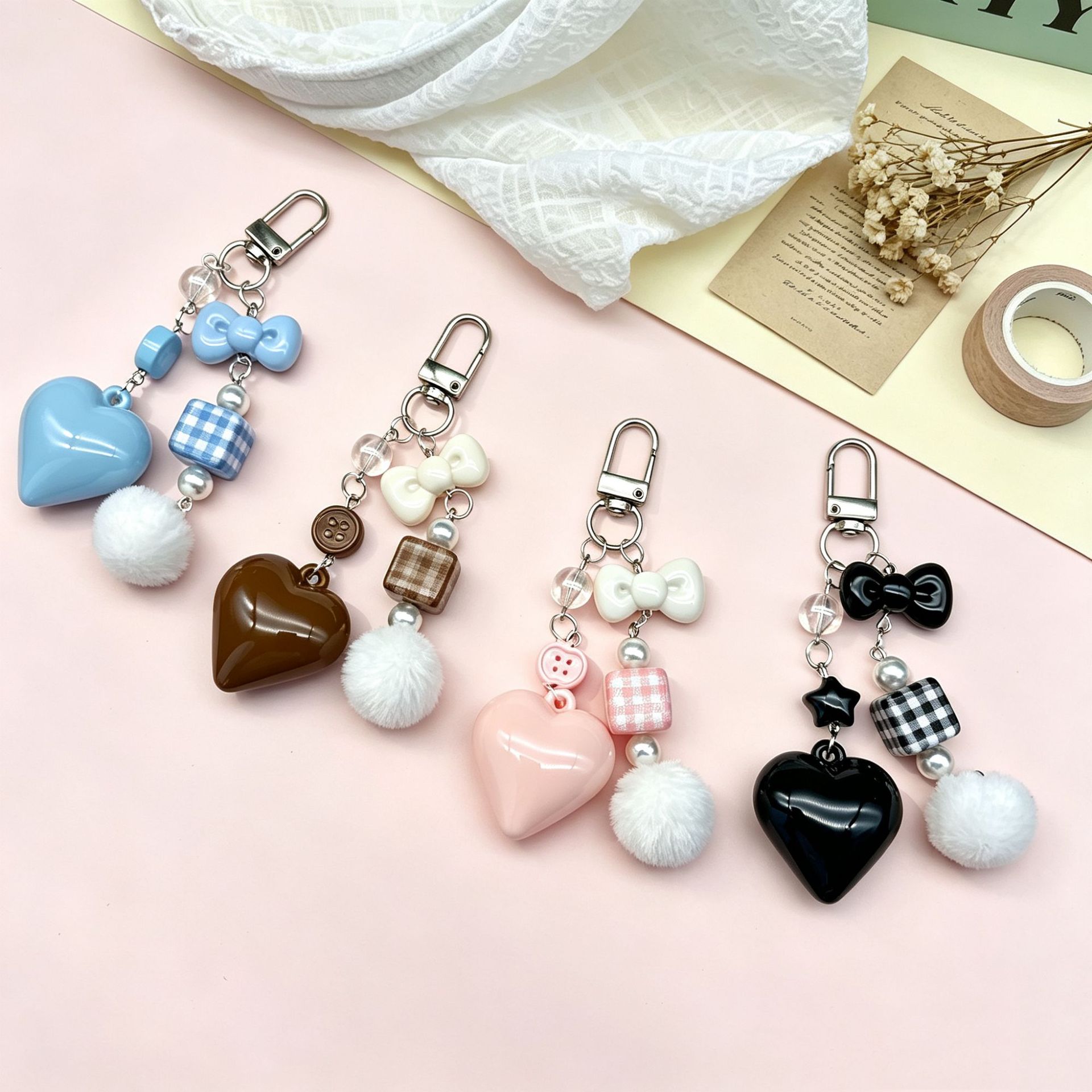 New style heart‑shaped plaid small fur ball keychain pendant, women’s creative and cute bag charm, AirPods protective case pendant