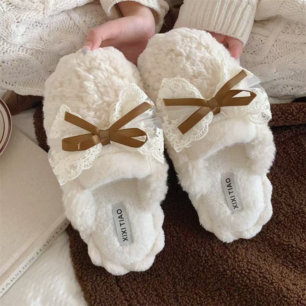 Winter plush slippers—sweet and cute furry shoes with bow accents; fluffy cotton slippers perfect for indoor use in winter.