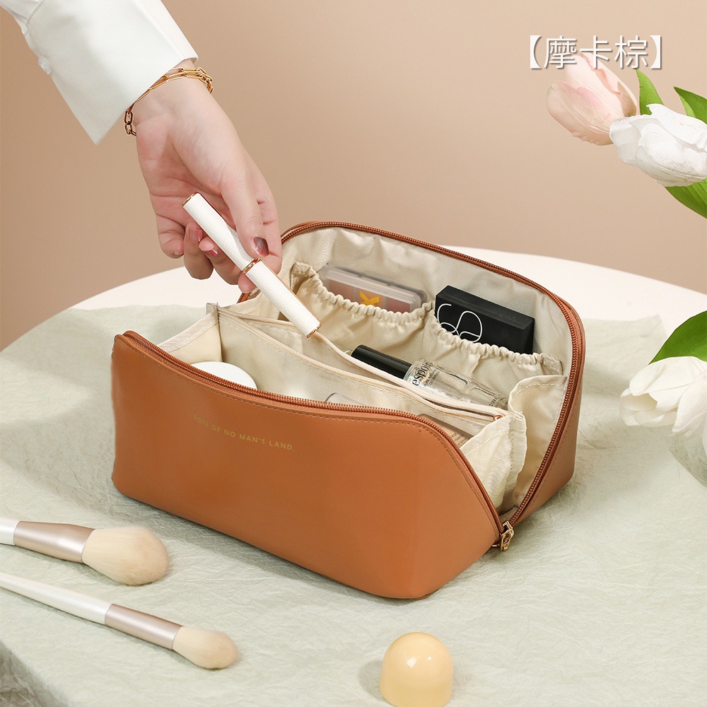 Simple and stylish PU women’s pillow-shaped makeup bag—large capacity, portable toiletry organizer for cosmetics and travel storage.