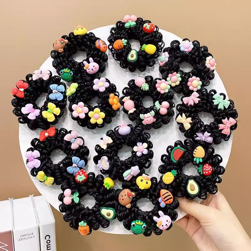 Children’s new cartoon hair ties, a pair—elastic ponytail holders for buns, faux hair, and updos; princess‑style baby hair bands with flower accents.