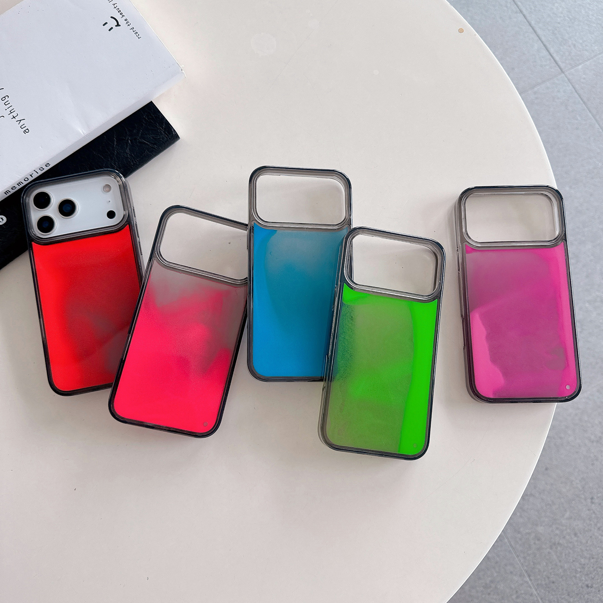 Translucent glow‑in‑the‑dark quicksand iPhone 18 Pro Max case; soft edges, hard back—black, compatible with iPhone 17 Pro and 15/16.